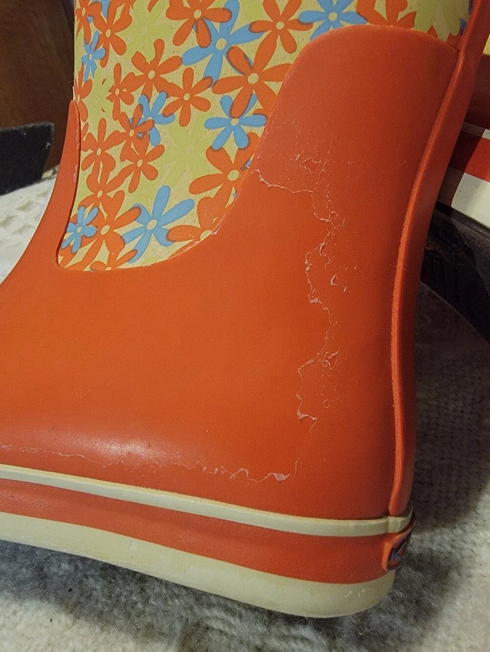 Keen orange and floral-patterned Coronado kids' waterproof rain boots